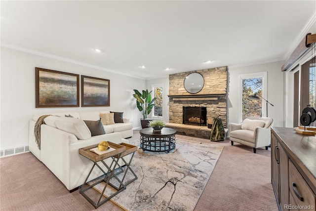 carpeted living room with crown molding and a fireplace