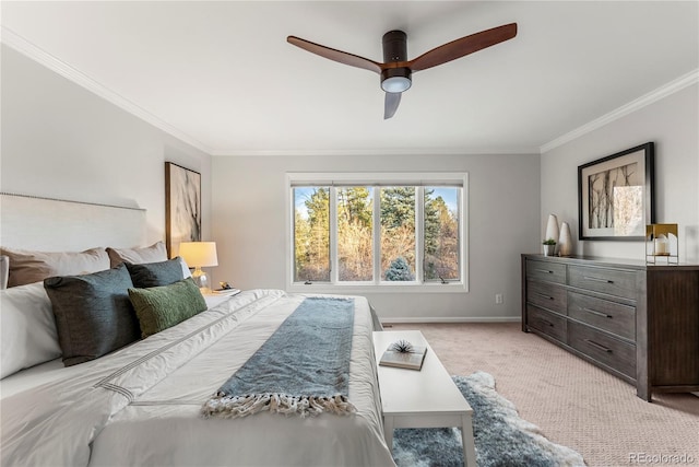 bedroom with light colored carpet, ceiling fan, and crown molding