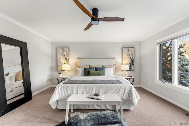 carpeted bedroom with ceiling fan and ornamental molding