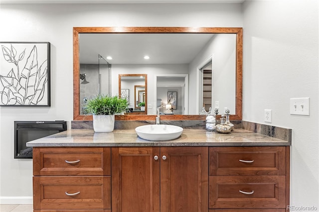 bathroom with heating unit and vanity