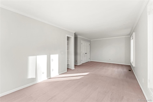 carpeted empty room featuring ornamental molding