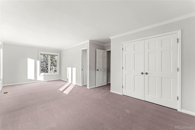 interior space featuring light colored carpet and ornamental molding