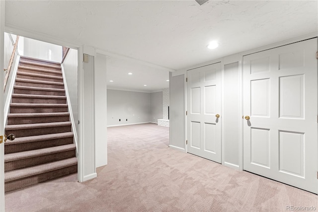 basement with light colored carpet