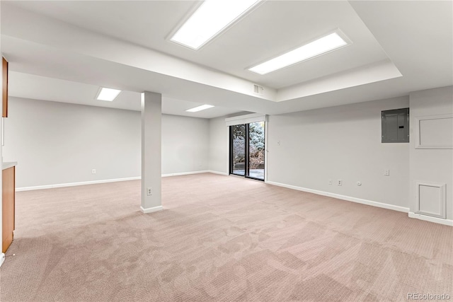 basement featuring electric panel and light colored carpet