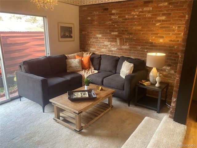 carpeted living room with an inviting chandelier