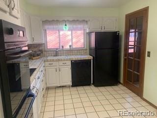 kitchen featuring decorative backsplash, black appliances, tile countertops, white cabinetry, and light tile patterned flooring