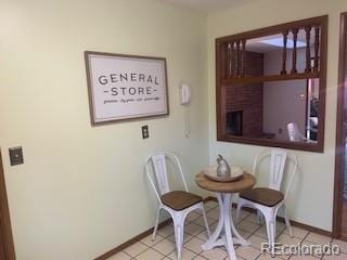 dining space with light tile patterned floors