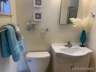 bathroom with vanity and toilet