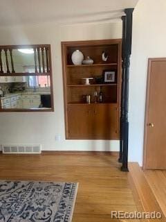 hallway featuring hardwood / wood-style flooring