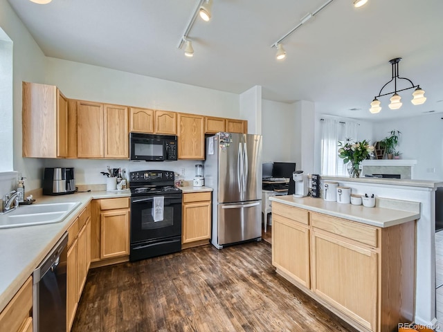 kitchen with sink, dark hardwood / wood-style flooring, hanging light fixtures, black appliances, and light brown cabinets