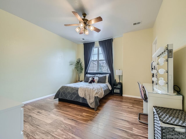 14700 E 104th Ave Unit 2605, Commerce City, CO 80022 - bedroom featuring wood-type flooring, baseboards, and ceiling fan