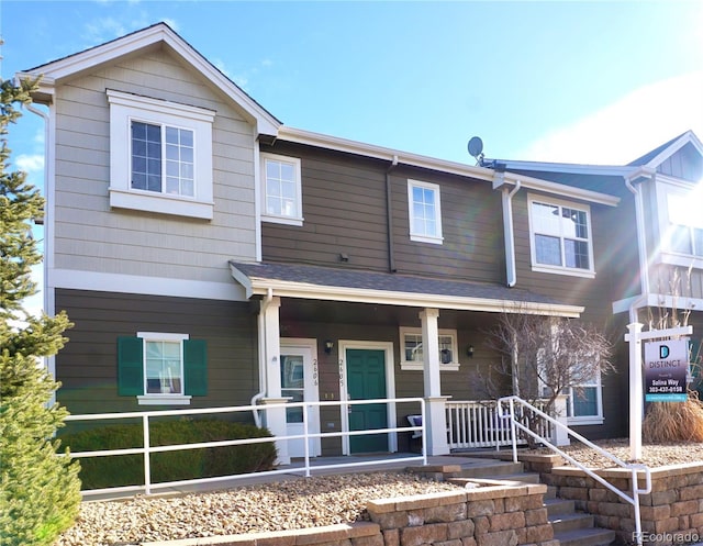 14700 E 104th Ave Unit 2605, Commerce City, CO 80022 - view of front of property featuring a porch