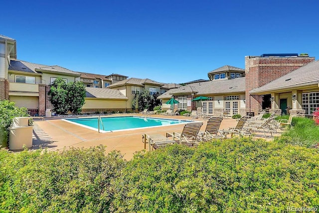 community pool featuring a patio area