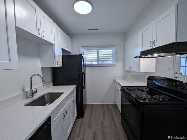 921 Mt Massive Dr Unit 25, Leadville, CO 80461 - kitchen featuring black appliances, a sink, under cabinet range hood, white cabinets, and dark wood finished floors