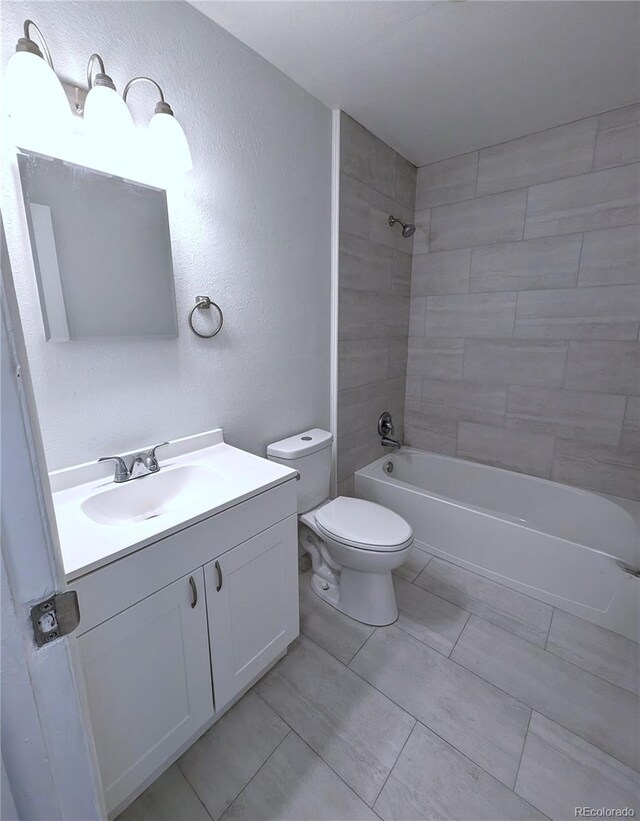 921 Mt Massive Dr Unit 25, Leadville, CO 80461 - full bath featuring a textured wall, vanity, toilet, bathing tub / shower combination, and tile patterned flooring