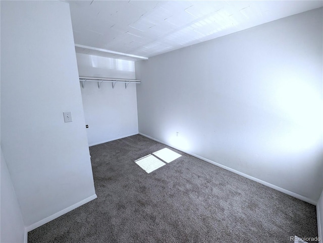 921 Mt Massive Dr Unit 25, Leadville, CO 80461 - unfurnished bedroom featuring dark colored carpet and baseboards