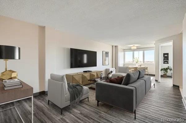 2225 Buchtel Blvd Unit 1003, Denver, CO 80210 - living room featuring baseboards, a textured ceiling, and wood finished floors