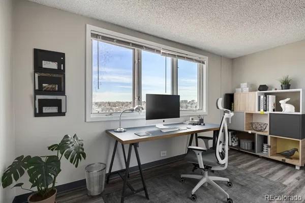 2225 Buchtel Blvd Unit 1003, Denver, CO 80210 - office area featuring baseboards, a textured ceiling, and wood finished floors
