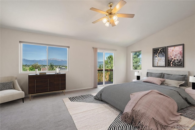 4839 Spotted Horse Dr, Colorado Springs, CO 80923 - bedroom featuring access to exterior, light colored carpet, lofted ceiling, and ceiling fan