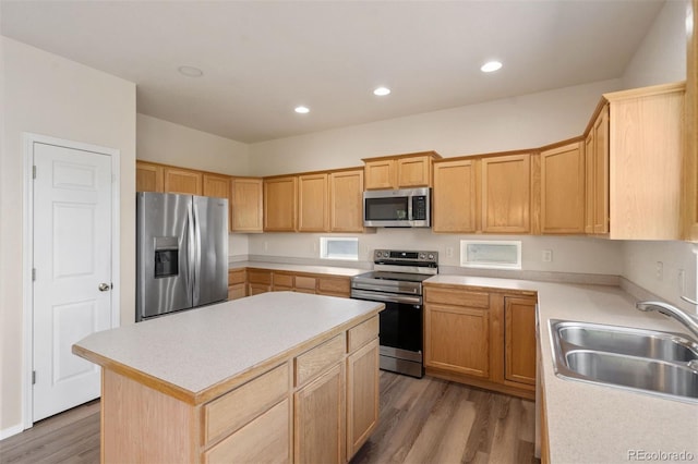 4839 Spotted Horse Dr, Colorado Springs, CO 80923 - kitchen with stainless steel appliances, light countertops, light wood finished floors, a center island, and recessed lighting