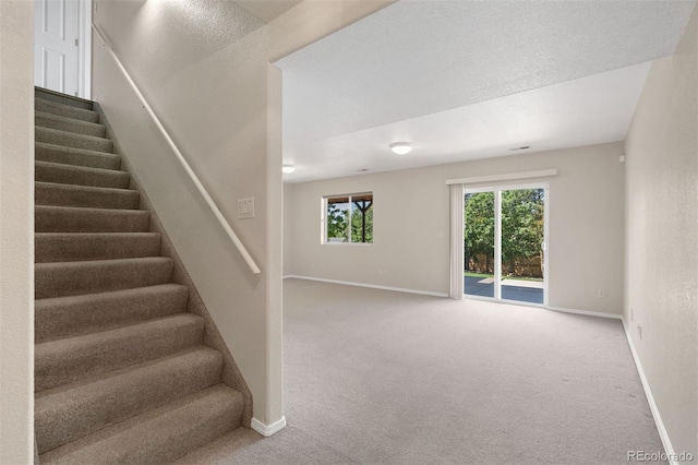 4839 Spotted Horse Dr, Colorado Springs, CO 80923 - stairs featuring carpet flooring and baseboards