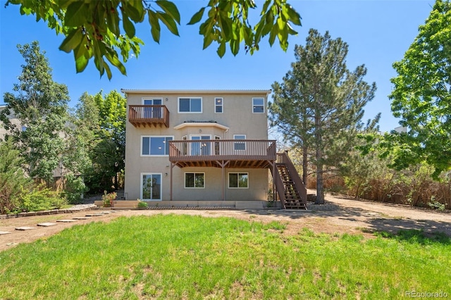 4839 Spotted Horse Dr, Colorado Springs, CO 80923 - rear view of property with stairway, a yard, stucco siding, a deck, and a balcony
