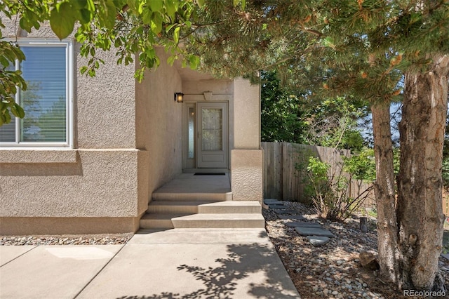 4839 Spotted Horse Dr, Colorado Springs, CO 80923 - doorway to property featuring stucco siding