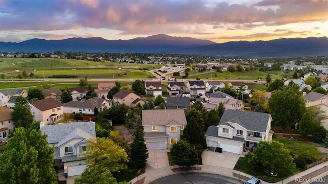 4839 Spotted Horse Dr, Colorado Springs, CO 80923 - aerial view at dusk of a mountain view and a residential view