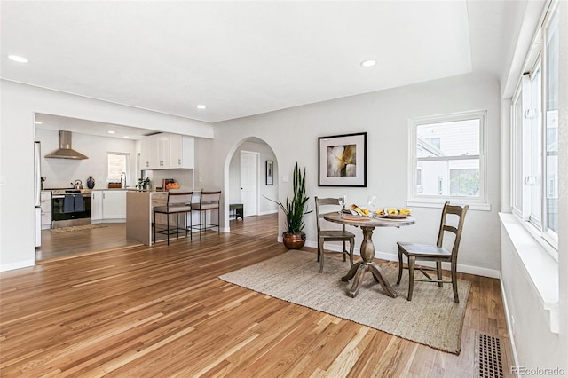 dining area featuring light wood-type flooring