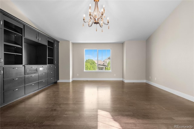 23870 E Dorado Pl, Aurora, CO 80016 - unfurnished living room featuring a chandelier, dark wood finished floors, and baseboards