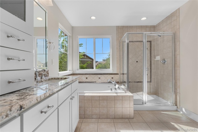 23870 E Dorado Pl, Aurora, CO 80016 - full bathroom with a stall shower, tile patterned flooring, vanity, a bath, and recessed lighting
