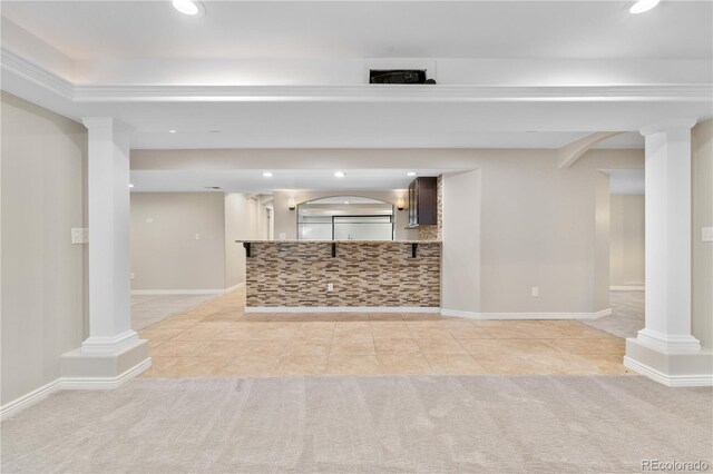 23870 E Dorado Pl, Aurora, CO 80016 - unfurnished living room featuring decorative columns, recessed lighting, and light carpet