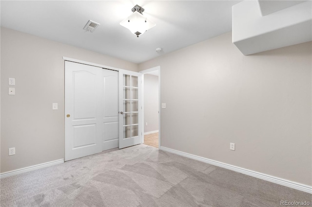 23870 E Dorado Pl, Aurora, CO 80016 - unfurnished bedroom featuring carpet floors, a closet, baseboards, and french doors