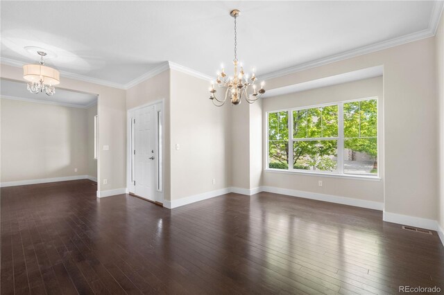 23870 E Dorado Pl, Aurora, CO 80016 - spare room featuring a chandelier, ornamental molding, dark wood-style floors, and baseboards