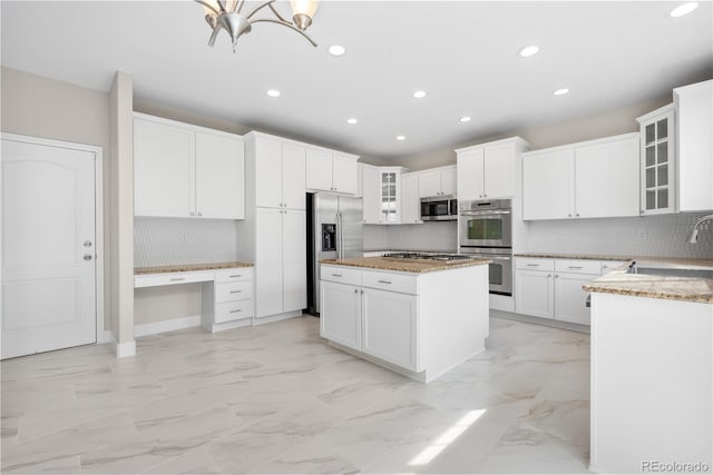 23870 E Dorado Pl, Aurora, CO 80016 - kitchen featuring stainless steel appliances, a sink, recessed lighting, a kitchen island, and light marble finish flooring