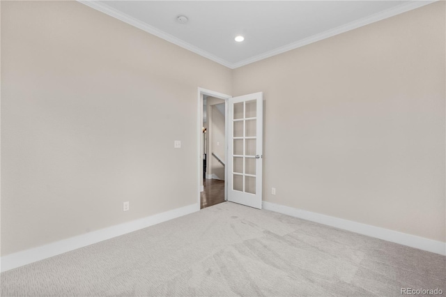 23870 E Dorado Pl, Aurora, CO 80016 - empty room featuring french doors, light carpet, ornamental molding, a smoke detector, and baseboards