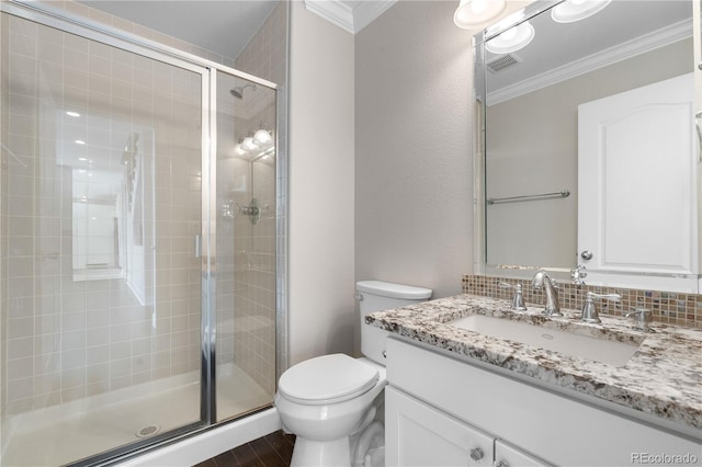 23870 E Dorado Pl, Aurora, CO 80016 - bathroom featuring crown molding, a stall shower, toilet, and vanity