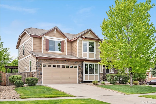 23870 E Dorado Pl, Aurora, CO 80016 - view of front of property featuring stone siding, concrete driveway, and a garage