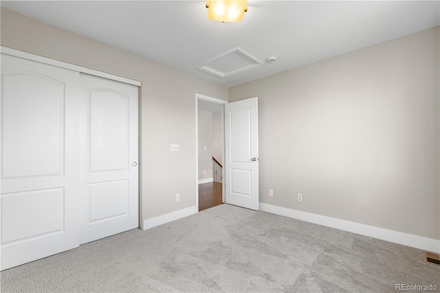 23870 E Dorado Pl, Aurora, CO 80016 - unfurnished bedroom featuring carpet flooring, attic access, a closet, and baseboards
