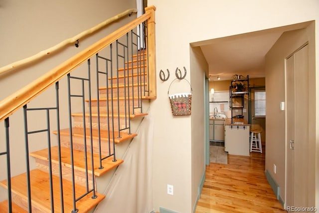 stairs with wood finished floors