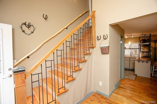 stairs with wood finished floors