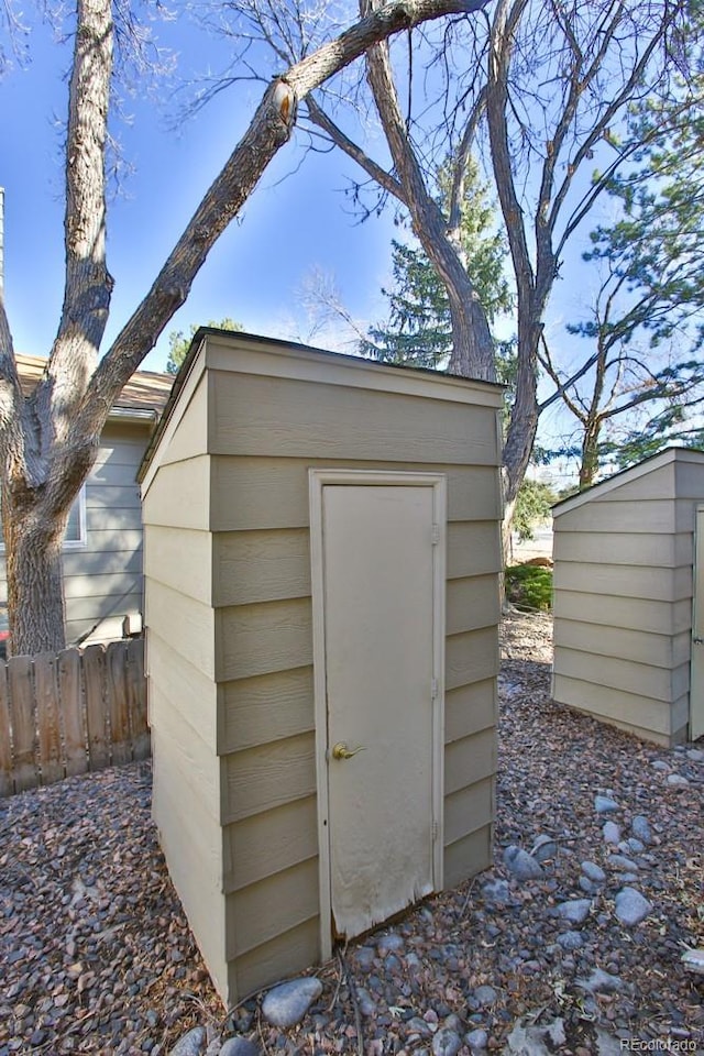 view of shed with fence