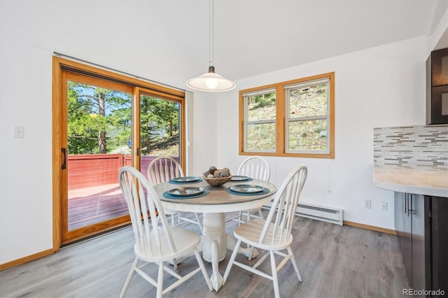 7350 Timber Trail Rd, Evergreen, CO 80439 - dining space featuring light wood-type flooring and baseboards