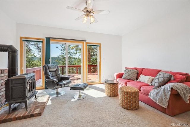 7350 Timber Trail Rd, Evergreen, CO 80439 - carpeted living area with a wood stove and ceiling fan