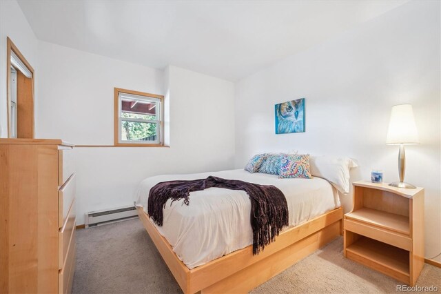 7350 Timber Trail Rd, Evergreen, CO 80439 - bedroom featuring a baseboard heating unit and carpet