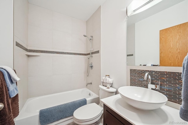 7350 Timber Trail Rd, Evergreen, CO 80439 - bathroom featuring decorative backsplash, vanity, toilet, and bathing tub / shower combination
