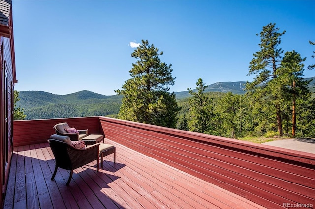 7350 Timber Trail Rd, Evergreen, CO 80439 - wooden terrace featuring a mountain view
