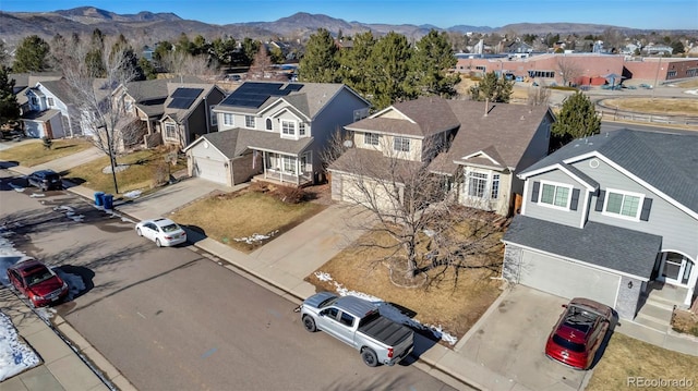 birds eye view of property with a mountain view