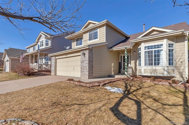 view of front facade with a garage and a front lawn