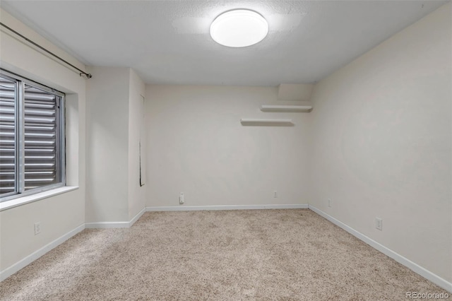 12047 W Coal Mine Dr, Littleton, CO 80127 - unfurnished room featuring baseboards and carpet